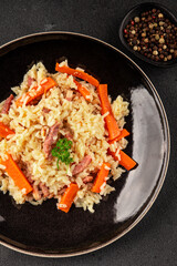 Rice meat and vegetables pilaf fresh delicious gourmet food background on the table rustic food top...