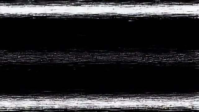 Abstract close-up of black painted wood with cracked texture, creating a dark and textured pattern
