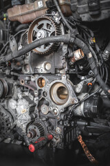 A detailed view of an engine's intricate mechanisms, featuring gears and belts in a car's mechanics.