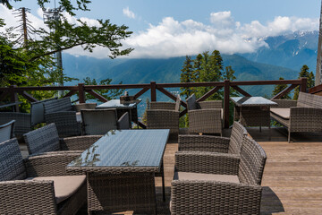 Tables on the veranda in the restaurant overlooking the mountains, Krasnaya Polyana, Sochi