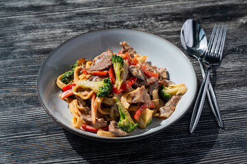 Pasta with beef, mushrooms and vegetables. 