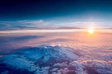 A breathtaking sunrise over a snow-capped mountain above the clouds