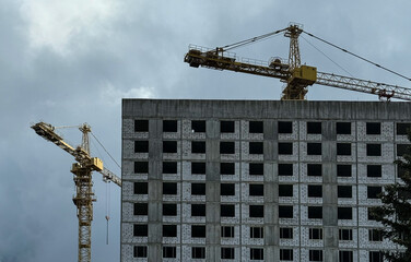 Crane and building construction. construction site. Multi Storey Residential Buildings...