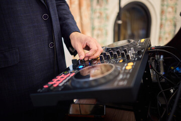 Witness the DJ mixing equipment performing live and in action at a vibrant music event