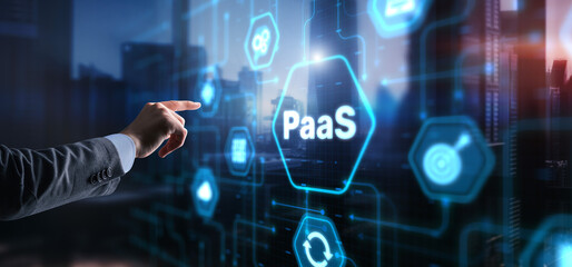 Hand pressing button on interface PaaS, Platform as a Service. Internet and networking concept