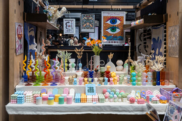 London, UK, 9 May 2025 People Walk Along a Busy Street Lined with Shops.