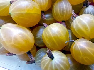 Fresh Gooseberry Berries Displayed in a Box Ready for Sale at the Local Market in Summer