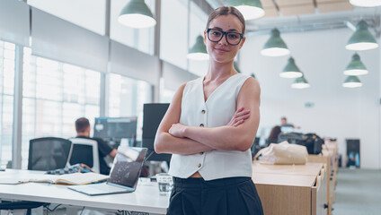 A Professional Woman Excelling in a Modern Office Environment with an Innovative Atmosphere