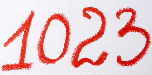 A number written in red chalk or pastel on a white background, with the texture of the strokes visible
