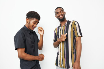 Happy African American men enjoying a fun moment together, showcasing friendship and joy. Perfect...