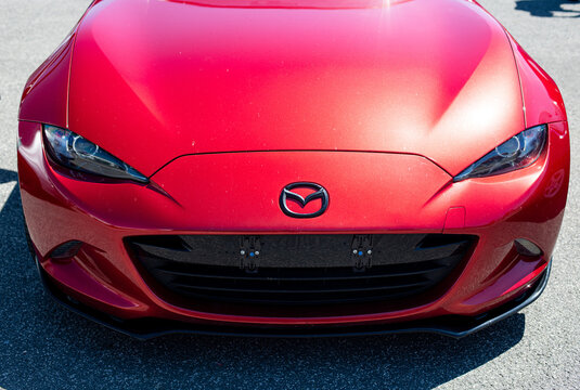 Mazda MX5 Miata, red japanese sport car detail, front high angle view