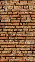 Vintage brick wall texture with rough surface and natural lighting