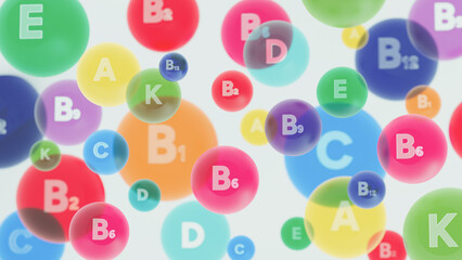 Brightly coloured vitamins on a white background. Colorful 3D vitamin bubbles with letters A, B, C, D, E, K on white background. Abstract concept for healthy nutrition, supplements, multivitamins.