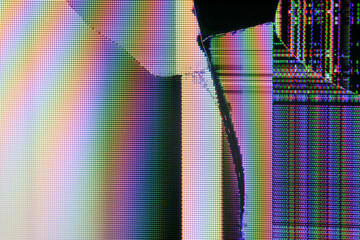 Close-up of a shattered LCD screen displaying colorful glitch patterns, horizontal scan lines, and...