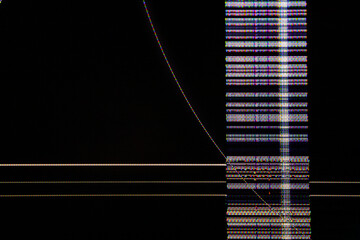 Close-up of a damaged LCD display showing horizontal and vertical pixel glitches, colorful screen...