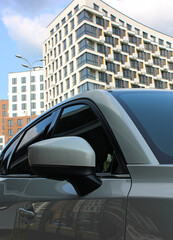 Close Up Stock Photo Of Car Mirror Standing Against Modern City Building Background  