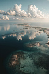 aerial view of oceans surface serene reflection of clouds in calm water