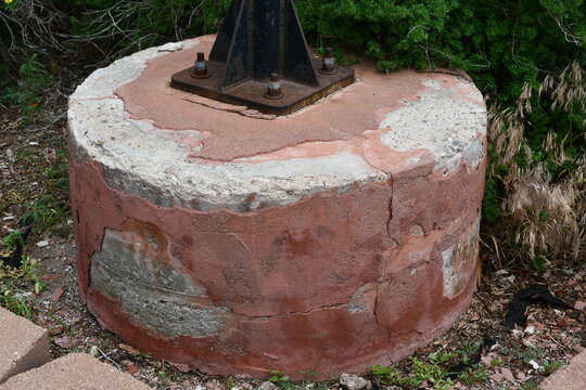 Huge concrete base for light pole baseplate.