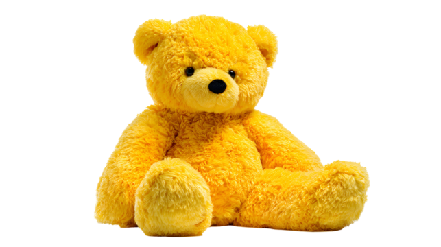A yellow teddy bear is sitting 