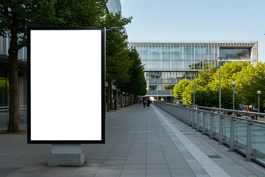 Mockup empty white advertising placed at side of city path. Outdoor advertisement template poster for urban commercial marketing campaigns. Selective focus