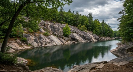 a body of water surrounded by rocks and trees
