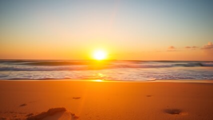 Obraz premium Sunset beach scene with golden light, evoking relaxation and natural beauty.