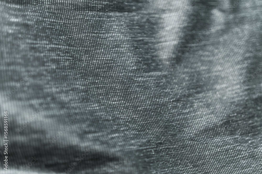 Poster An abstract view of dark black and white fabric with a subtle ribbed texture creating depth and visual interest. Perfect as a background or overlay, adding a touch of elegance and sophistication. 