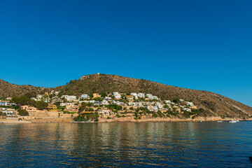 Fototapeta premium Playa El Portet en Moraira, Alicante al atardecer, El Portet Beach in Moraira, Alicante at sunset 2025