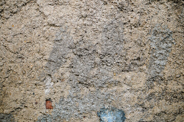 Detailed gray cement wall texture provides a naturally rough, aged surface. Ideal as a textured backdrop or pattern element for backgrounds. The material shows a concrete structure.