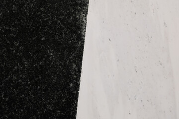 Textures, a stark contrast between a rough dark material and a smooth lighter surface