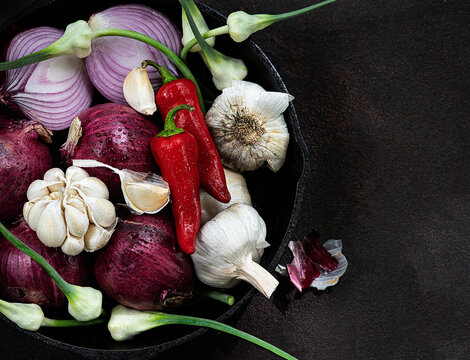 Garlic, garlic flowers and red onions 