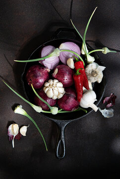 Garlic, garlic flowers and red onions 