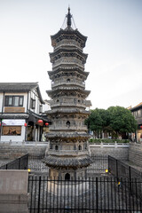 Stone octagonal pagoda showcasing traditional architecture at Nanxiang Water Town in Shanghai,...