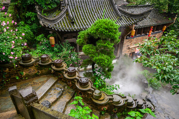 Chinese architecture with a mossy tile roof is showcased at Huangling Village in Wuyuan, Jiangxi,...