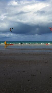 Verticle - A perfect afternoon on the beach for the kite surfing club.