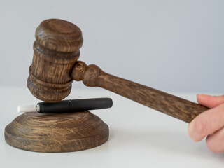 Judge's gavel and electronic cigarette. Tobacco heating system. 