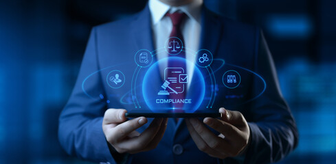 Businessman holding smartphone with compliance icons on screen - business and regulations concept