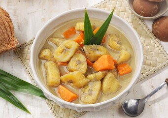 Kolak Pisang is an Indonesian dessert made from bananas, pumpkin cooked with coconut milk, palm sugar and pandan leaves.