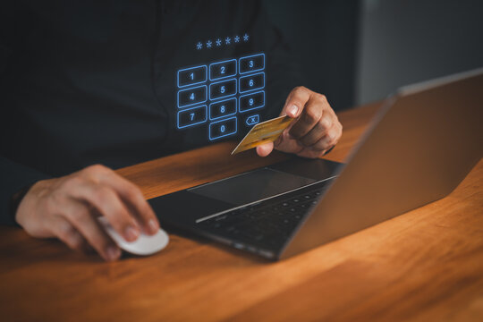 Man entering PIN code while holding a credit card, with virtual numeric keypad on screen. Concept of secure online payment, cybersecurity, internet banking, and digital transaction authentication.