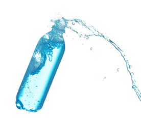 Plastic bottle with splashing water in air on white background