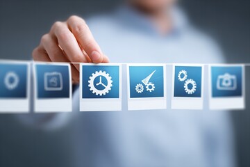 Creative display of various technology and design icons hanging on a string in a modern workspace setting