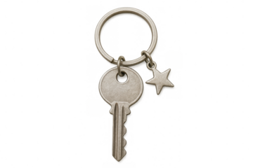Metal key with star pendant hanging from keyring isolated on transparent background, perfect for security and access concepts