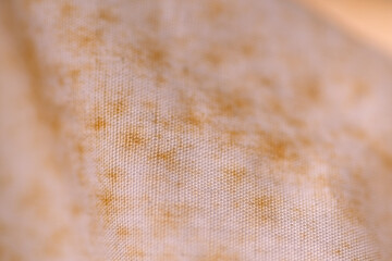 Brown stain appear on white stored cloth due to poorly ventilation
