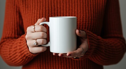 Woman's Hands Holding White Mug, Wearing Rings, Cozy Orange Sweater