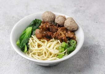 Mie ayam bakso. Bakso chicken noodles is a typical Indonesian dish made from wheat noodles seasoned with pieces of chicken and meatballs