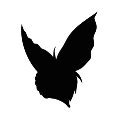 Silhouette of a fantastical winged creature with large ornate wings