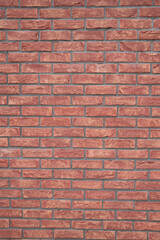 Detailed view of a sturdy red brick wall showcasing craftsmanship and architectural design Perfect for backgrounds and textures
