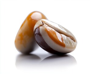 Close-up of Two Glossy Coffee Beans on White Background with Soft Reflection and Natural Light