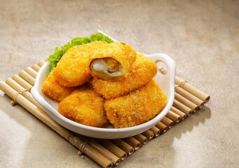 Risol Mayo or Risoles mayonnaise is a traditional roll-shaped snack that has various fillings, from ragout, eggs, to smoked beef.