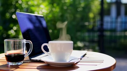 Laptop and coffee outdoor workspace